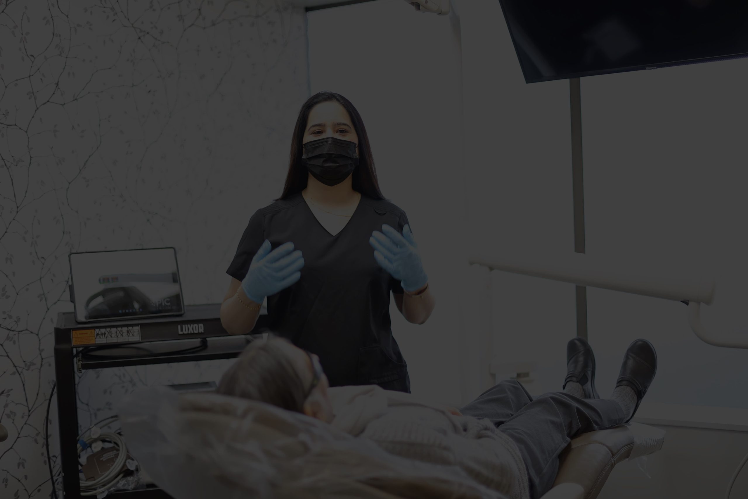 Photo of Dr. Tobias giving a patient a high five
